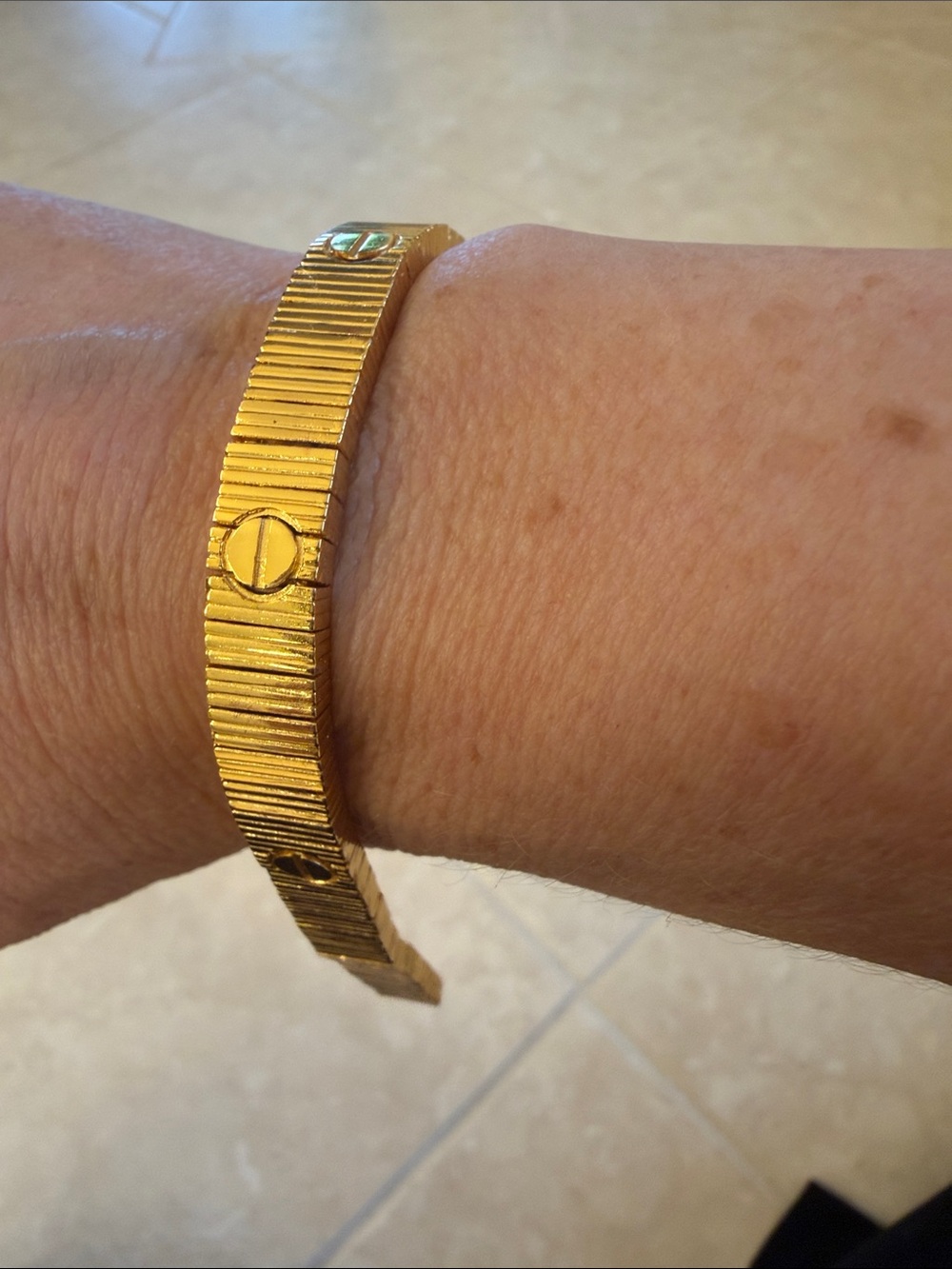 Gold bracelet with screw design